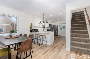 Cincinnati apartment for rent - A kitchen with a dining table and chairs is available for rent.
