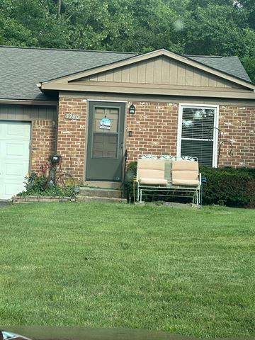 Galloway apartment for rent - A house with a grey door and a brick wall.