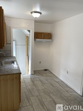 Detroit house for rent - A kitchen area with a sink and a counter.