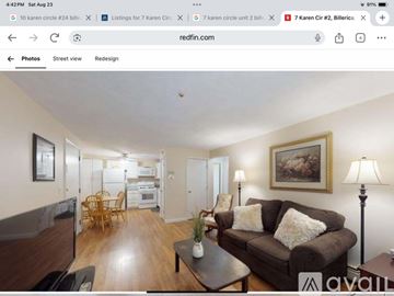 Billerica condo for rent - A living room with a brown couch and a painting on the wall.