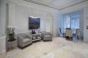 Coral Gables apartment for rent - a living room with a table and chairs and a painting on the wall