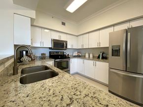 Coral Gables apartment for rent - a kitchen with stainless steel appliances and granite counter tops