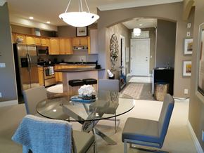 Edmonton apartment for rent - A modern kitchen with a glass table and chairs.