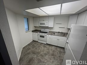Ocala condo for rent - A room with a carpeted floor and a window.
