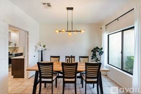 Glendale house for rent - A dining room with a wooden table and chairs.