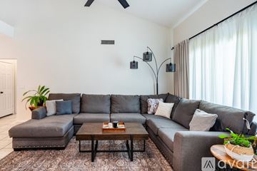 Glendale house for rent - A living room with a grey sofa and a wooden coffee table.