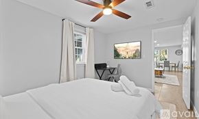 Alexandria apartment for rent - A bedroom with a large bed and a ceiling fan.