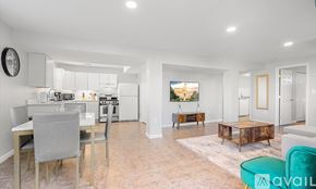 Alexandria apartment for rent - A modern kitchen with a dining table and chairs.