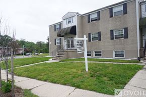 Baltimore apartment for rent - A building with a for lease sign in front of it.