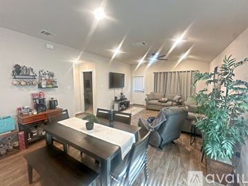 San Antonio house for rent - A well-lit living room with a dining table and chairs.
