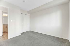 Edmonton apartment for rent - A room with a grey carpet and white walls.