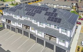 Saskatoon apartment for rent - A building with solar panels on the roof.