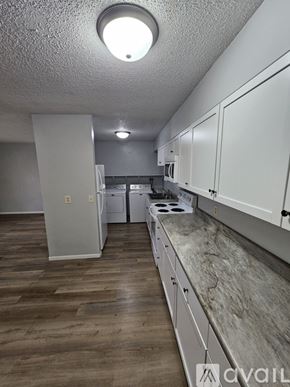 Saint Charles apartment for rent - A kitchen with a stove, sink, and refrigerator.