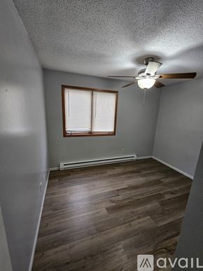 Saint Charles apartment for rent - A parking lot with a building in the background.