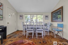 York house for rent - A dining room with a white table and chairs.