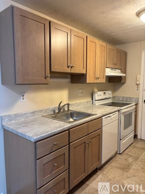 Manchester apartment for rent - A house with a brick chimney and a large window.