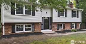 Chesterfield County house for rent - A house with a black front door and windows.
