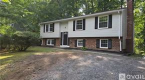 Chesterfield County house for rent - A house with a gravel driveway in front of it.