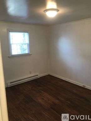 Kinston house for rent - A room with a window and wooden flooring.
