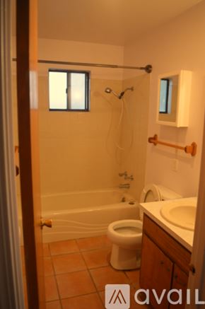 Santa Fe apartment for rent - A bathroom with a toilet, sink, and bathtub.