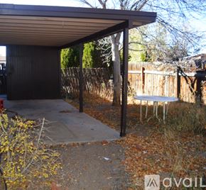 Santa Fe apartment for rent - A patio area with a table and chairs is shown.