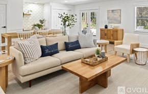 Santa Rosa Beach house for rent - A living room with a sofa, armchair, and coffee table.