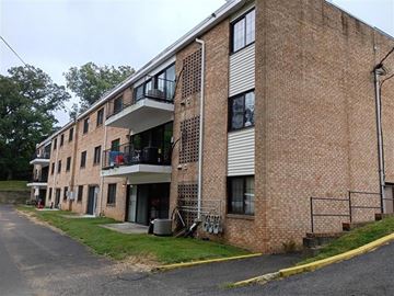 Arlington apartment for rent - A brick building with a balcony on the second floor.