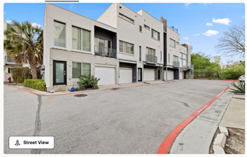 Austin apartment for rent - A street view of a residential area with modern buildings.