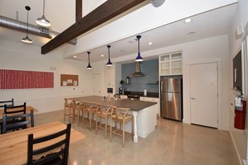 Haslet apartment for rent - A kitchen with a long table and chairs.