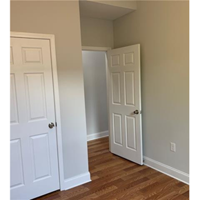 New Orleans apartment for rent - A white door is open to a hallway.