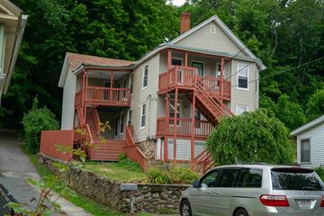 Southbridge apartment for rent - A house with a red deck and stairs.