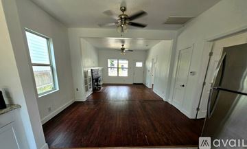 San Antonio house for rent - A kitchen with white cabinets and a granite countertop.