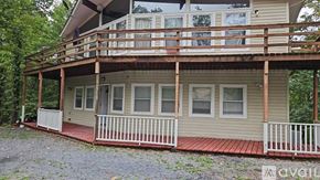 Mount Jackson apartment for rent - A house with a balcony and a red floor.