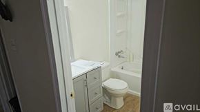 Mount Jackson apartment for rent - A white toilet sits in a bathroom next to a white cabinet.