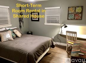 Lubbock house for rent - A bedroom with a bed, desk, and chair is available for short-term room rental in a shared house.