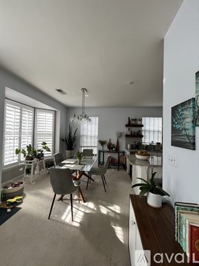 Alexandria condo for rent - A well-lit, modern kitchen and dining area with a table set for two.