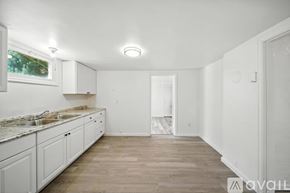 College Place apartment for rent - A kitchen with white cabinets and a countertop is available for rent.
