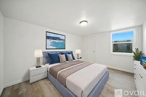 College Place apartment for rent - A room with wooden flooring and a window showing an outdoor view.