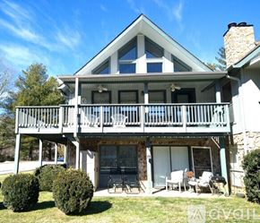 Sky Valley apartment for rent - A house with a balcony and a fireplace.