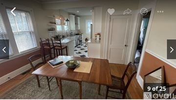 Asheville house for rent - A kitchen with a table and chairs in the foreground.