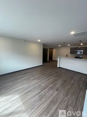 Altoona apartment for rent - A spacious room with wooden flooring and a white reception desk.
