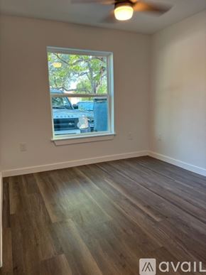 Blanco apartment for rent - A kitchen with a stainless steel refrigerator and white cabinets.