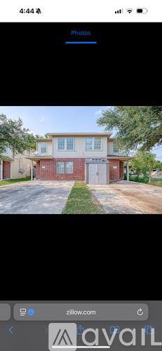 Houston townhouse for rent - A building with a white door and windows is shown.