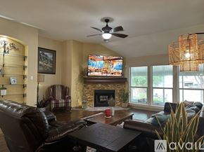 Schertz house for rent - A living room with a fireplace and a television.