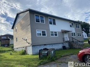 Oak Hill apartment for rent - A two-story house with a garage on the side.