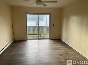 Oak Hill apartment for rent - A room with a sliding glass door leading to a balcony.