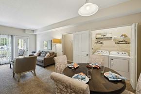 Westerville apartment for rent - A bedroom with a large bed and a chair.