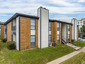 Weatherford apartment for rent - A row of houses with a grassy front yard.