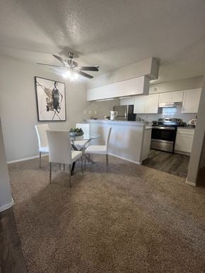 Weatherford apartment for rent - A kitchen with a dining table and chairs.