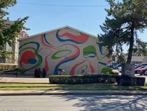 Arlington apartment for rent - A building with a colorful mural on its side.